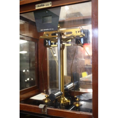 86 - A GLASS AND MAHOGANY CASED SET SCALES BY OERTLING OF LONDON