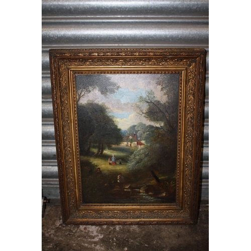 23 - AN ANTIQUE GILT FRAMED OIL ON CANVAS DEPICTING A WOODED RIVER LANDSCAPE WITH FIGURES - SIZE 40.5CM X... 