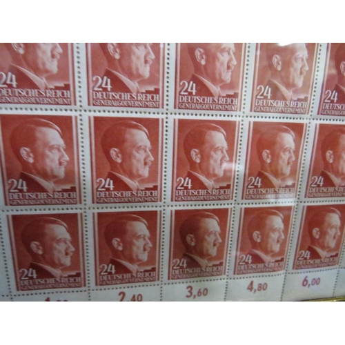 377 - A SHEET OF 50 WW2 DEUTCHES REICH STAMPS SHOWING THE PROFILE OF ADOLF HITLER SET IN A PERIOD GLAZED F... 