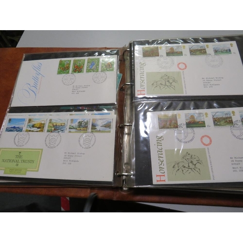 380 - AN ALBUM OF POST OFFICE FIRST DAY COVERS,  TOGETHER WITH THREE COMMEMORATIVE COINS AND STAMPS FIRST ... 