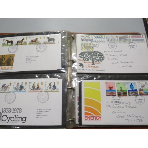 380 - AN ALBUM OF POST OFFICE FIRST DAY COVERS,  TOGETHER WITH THREE COMMEMORATIVE COINS AND STAMPS FIRST ... 