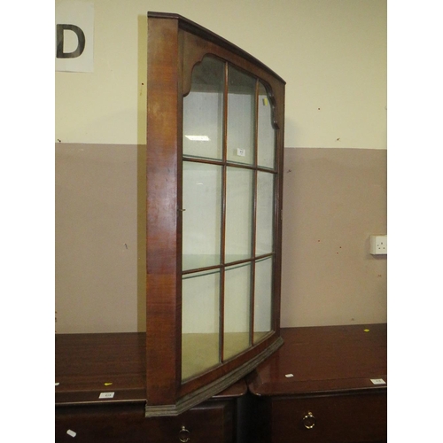 617 - AN ANTIQUE WALNUT GLAZED HANGING CORNER CABINET H-100 CM