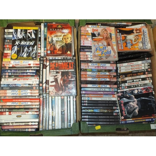 76 - FOUR TRAYS OF DVDS