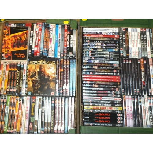 76 - FOUR TRAYS OF DVDS