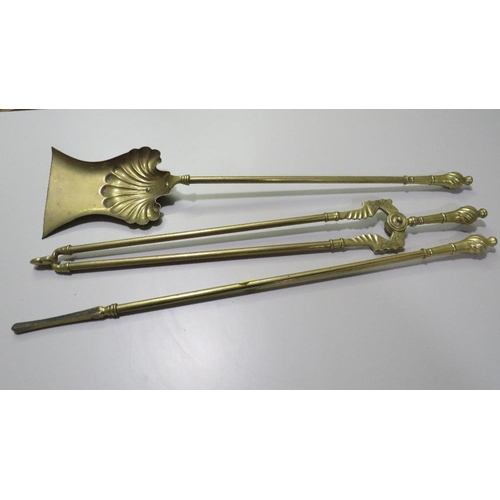 250 - A VINTAGE BRASS THREE PIECE FIRESIDE COMPANION SET