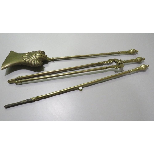 250 - A VINTAGE BRASS THREE PIECE FIRESIDE COMPANION SET