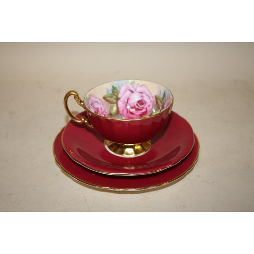 282 - AN AYNSLEY CABBAGE ROSE PATTERN CUP, SAUCER AND SIDEPLATE TRIO