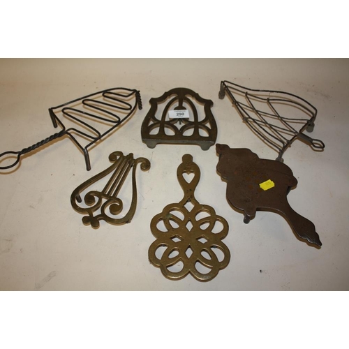 290 - A COLLECTION OF BRASS AND OTHER IRON TRIVETS