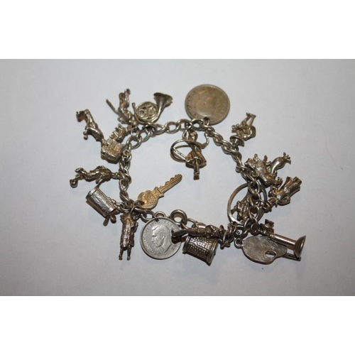 314 - A VINTAGE SILVER CHARM BRACELET, APPROX WEIGHT 46.5 G