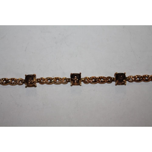 350 - A 9 CARAT GOLD SMOKEY QUARTZ EIGHT STONE BRACELET A/F