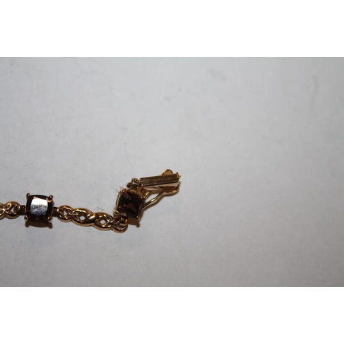350 - A 9 CARAT GOLD SMOKEY QUARTZ EIGHT STONE BRACELET A/F
