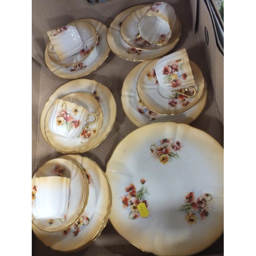 136 - A TRAY OF NAUTILUS FLORAL PORCELAIN CHINA