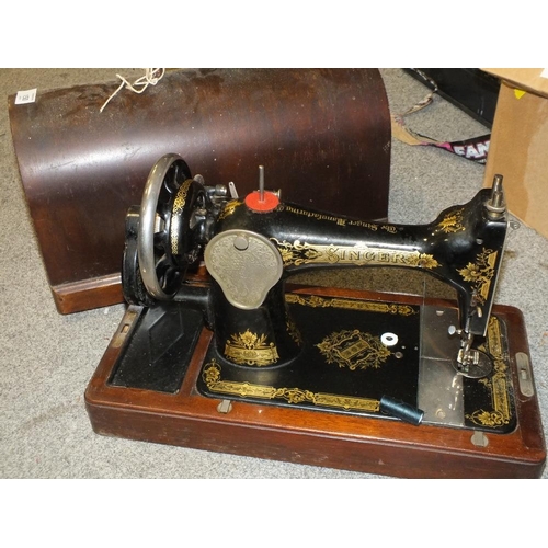 150 - A CASED VINTAGE SINGER SEWING MACHINE