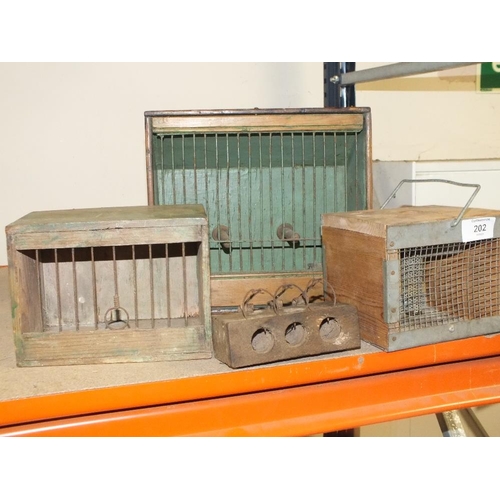 202 - A COLLECTION OF SMALL ANIMAL TRAVEL CASES AND TRAPS