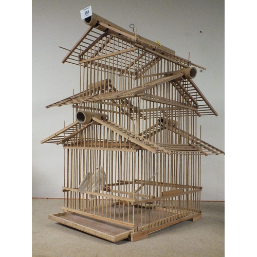 203 - A WOODEN/CANE BIRD DISPLAY CAGE