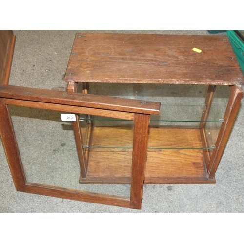 210 - A FOUR SIDED GLAZED OAK DISPLAY CABINET, H 41 CM, W 45.5 CM, D 25 CM