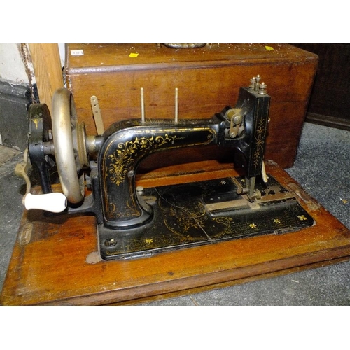 211 - AN INLAID MAHOGANY CASED ANTIQUE FRISTER AND ROSSMANN SEWING MACHINE