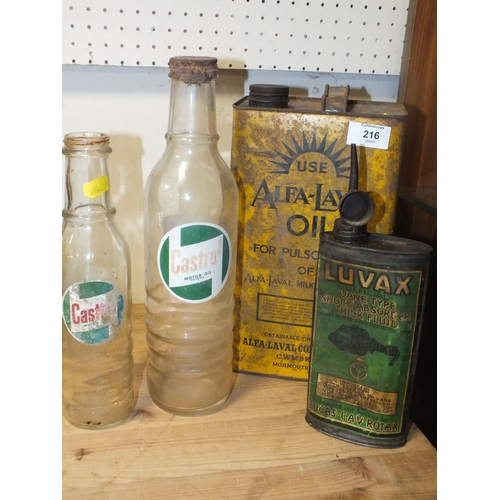 216 - A VINTAGE ALFA-LAVAL OIL CAN TOGETHER WITH TWO CASTROL MOTOR OIL BOTTLES AND A LUVAX SHOCK ABSORBER ... 