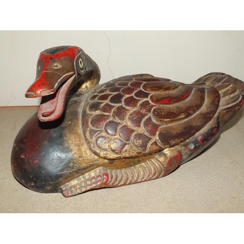 219 - AN INDONESIAN STYLE CARVED HARDWOOD FIGURE OF A DUCK, LENGTH 33 CM