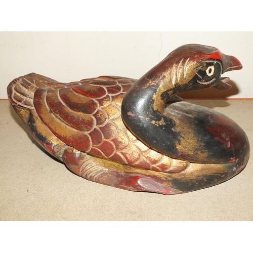 219 - AN INDONESIAN STYLE CARVED HARDWOOD FIGURE OF A DUCK, LENGTH 33 CM