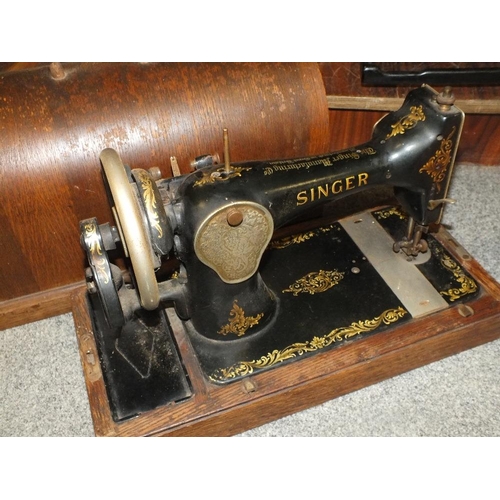 234 - A CASED VINTAGE SINGER SEWING MACHINE