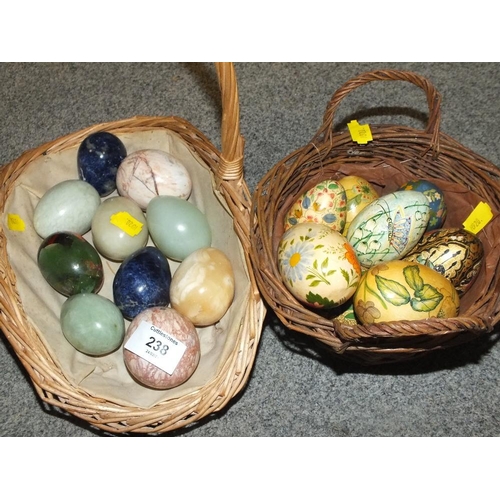 238 - A BASKET OF POLISHED HARD STONE EGGS TOGETHER WITH TWO BASKETS OF HAND PAINTED WOODEN EGGS