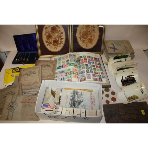 397 - A QUANTITY OF CIGARETTE CARDS BOTH LOOSE AND IN ALBUMS TOGETHER WITH A WORLD STAMP ALBUM, POSTCARDS ... 