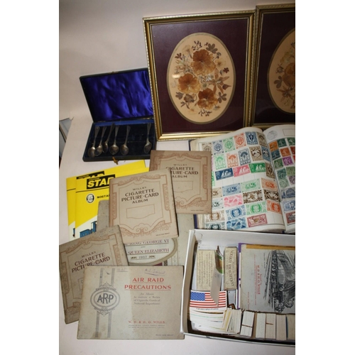 397 - A QUANTITY OF CIGARETTE CARDS BOTH LOOSE AND IN ALBUMS TOGETHER WITH A WORLD STAMP ALBUM, POSTCARDS ... 