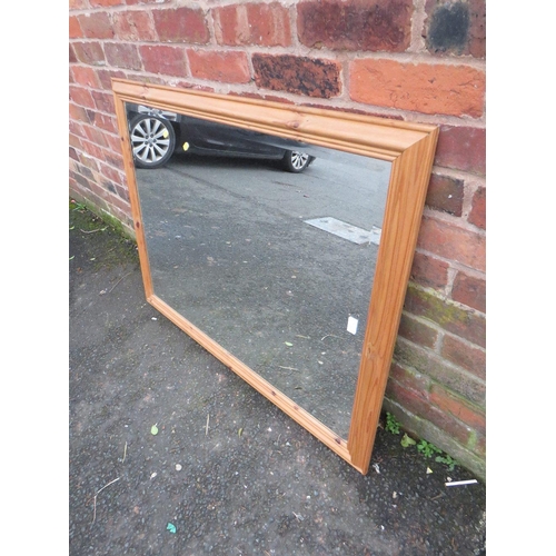 732 - A LARGE MODERN PINE FRAMED MIRROR 114 X 88 CM