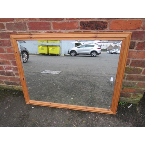 732 - A LARGE MODERN PINE FRAMED MIRROR 114 X 88 CM