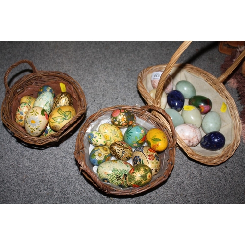 238 - A BASKET OF POLISHED HARD STONE EGGS TOGETHER WITH TWO BASKETS OF HAND PAINTED WOODEN EGGS