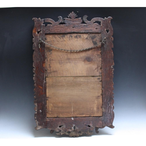 46 - CIRCA 16TH CENTURY. Profusely carved oak frame with later silvered mirror plate, width of frame 12 c... 