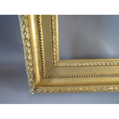 51 - A 19TH CENTURY GOLD FRAME WITH ACANTHUS LEAF DESIGN TO OUTER EDGE, frame W 8 cm, frame rebate 80.5 x... 