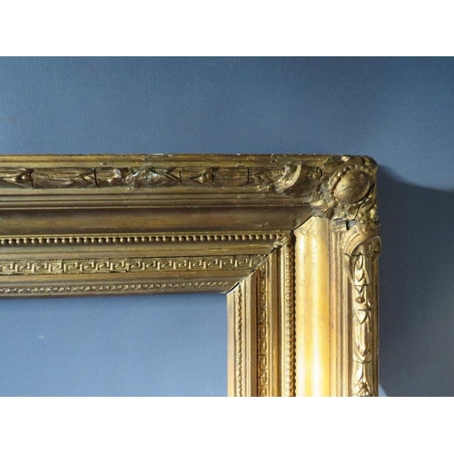 52 - A 19TH CENTURY GOLD FRAME WITH ACANTHUS LEAF DESIGN TO OUTER EDGE, frame W 10 cm, frame rebate 85.5 ... 