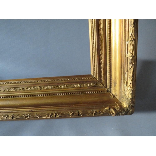 52 - A 19TH CENTURY GOLD FRAME WITH ACANTHUS LEAF DESIGN TO OUTER EDGE, frame W 10 cm, frame rebate 85.5 ... 