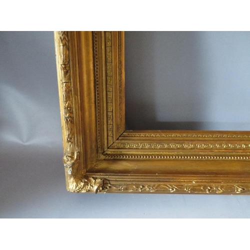 52 - A 19TH CENTURY GOLD FRAME WITH ACANTHUS LEAF DESIGN TO OUTER EDGE, frame W 10 cm, frame rebate 85.5 ... 