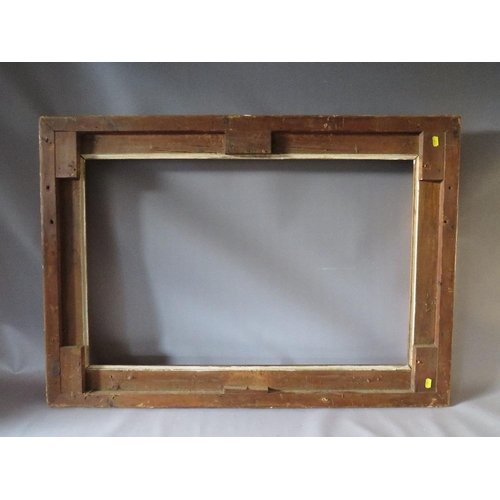 52 - A 19TH CENTURY GOLD FRAME WITH ACANTHUS LEAF DESIGN TO OUTER EDGE, frame W 10 cm, frame rebate 85.5 ... 