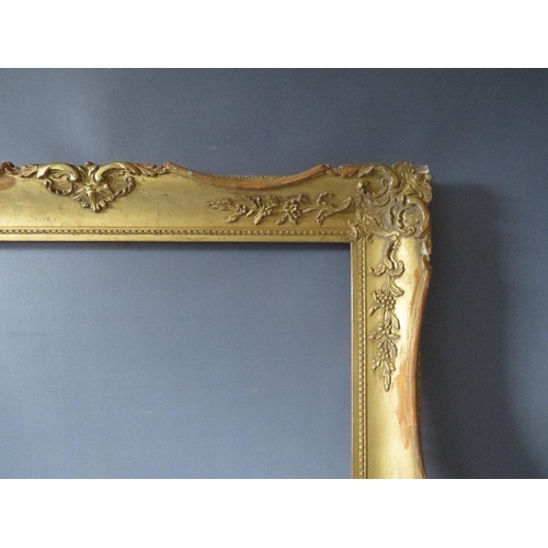 54 - A LATE 19TH / EARLY 20TH CENTURY GOLD SWEPT FRAME, frame W 8 cm, frame rebate 68.5 x 52.5 cm