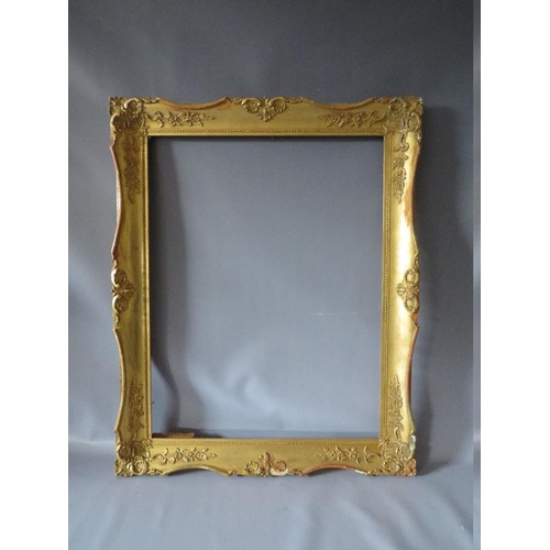 54 - A LATE 19TH / EARLY 20TH CENTURY GOLD SWEPT FRAME, frame W 8 cm, frame rebate 68.5 x 52.5 cm