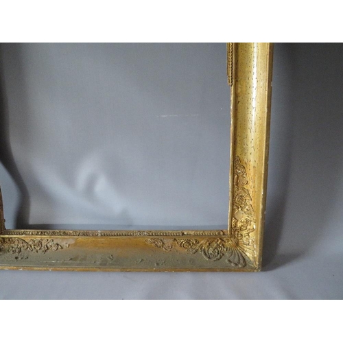 56 - AN 18TH CENTURY FRENCH DECORATIVE GOLD FRAME WITH INTEGRAL SLIP, frame W 8 cm, frame rebate 66 x 55 ... 