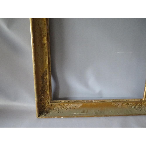 56 - AN 18TH CENTURY FRENCH DECORATIVE GOLD FRAME WITH INTEGRAL SLIP, frame W 8 cm, frame rebate 66 x 55 ... 