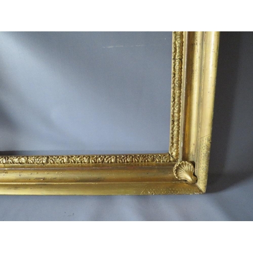 57 - AN 18TH CENTURY GOLD FRAME WITH SHELL EMBELLISHMENTS TO INNER CORNERS, frame W 7 cm, frame rebate 59... 