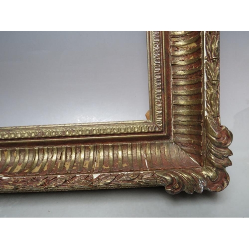 59 - A 20TH CENTURY DECORATIVE GOLD FRAME WITH CORNER EMBELLISHMENTS, frame W 7 cm, frame rebate 58.5 x 4... 