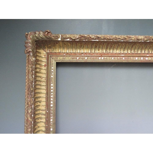 59 - A 20TH CENTURY DECORATIVE GOLD FRAME WITH CORNER EMBELLISHMENTS, frame W 7 cm, frame rebate 58.5 x 4... 