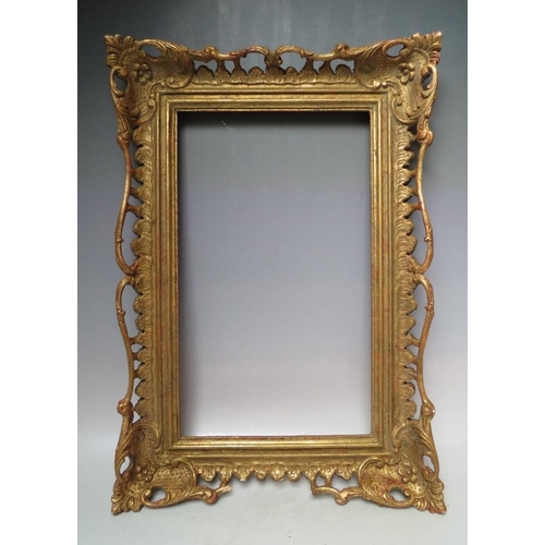 64 - AN EARLY 20TH CENTURY CHIPPENDALE STYLE GOLD PIERCED FRAME, frame W 9 cm, frame rebate 52 x 31.5 cmC... 
