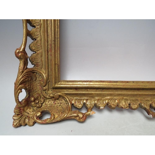 64 - AN EARLY 20TH CENTURY CHIPPENDALE STYLE GOLD PIERCED FRAME, frame W 9 cm, frame rebate 52 x 31.5 cmC... 