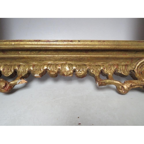 64 - AN EARLY 20TH CENTURY CHIPPENDALE STYLE GOLD PIERCED FRAME, frame W 9 cm, frame rebate 52 x 31.5 cmC... 