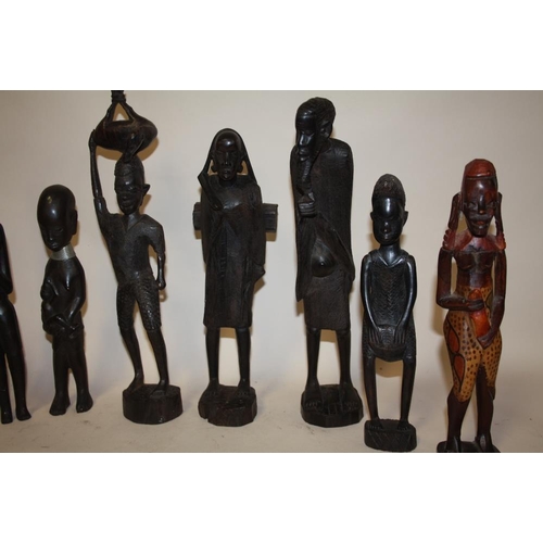 223 - A COLLECTION OF EIGHT ASSORTED CARVED WOODEN TRIBAL STYLE FIGURES