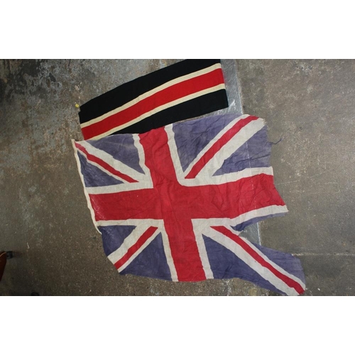 159 - A SUITCASE AND A BOX OF VINTAGE CLOTHING TO INCLUDE VINTAGE ICE SKATES, UNION JACK FLAG ETC.