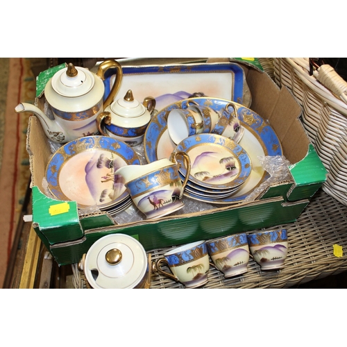 176 - A WICKER BASKET OF COLLECTABLES TOGETHER WITH AN ORIENTAL HAND PAINTED TEA SET